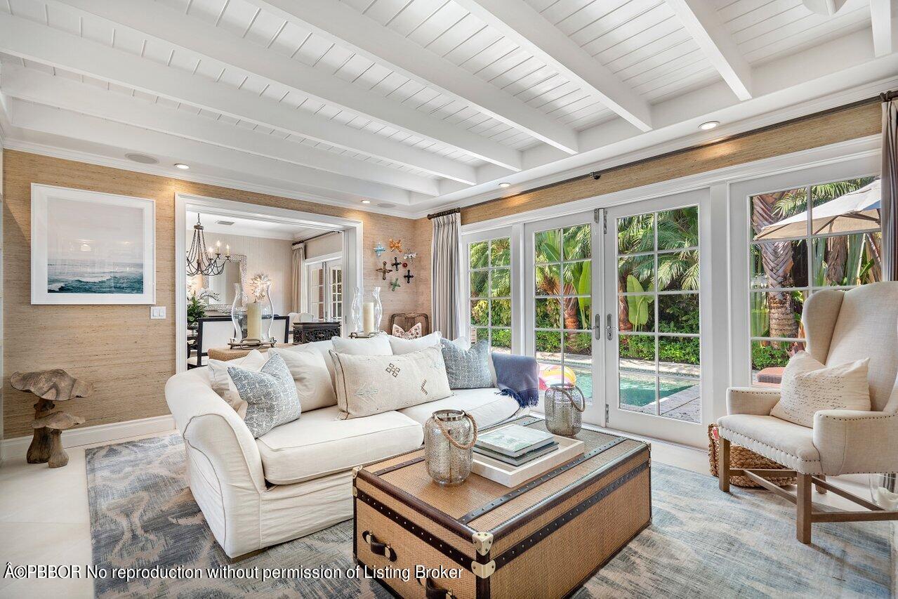 265 List Road Palm Beach, FL 33480 - Photo 13 of 39 a living room with furniture and a large window