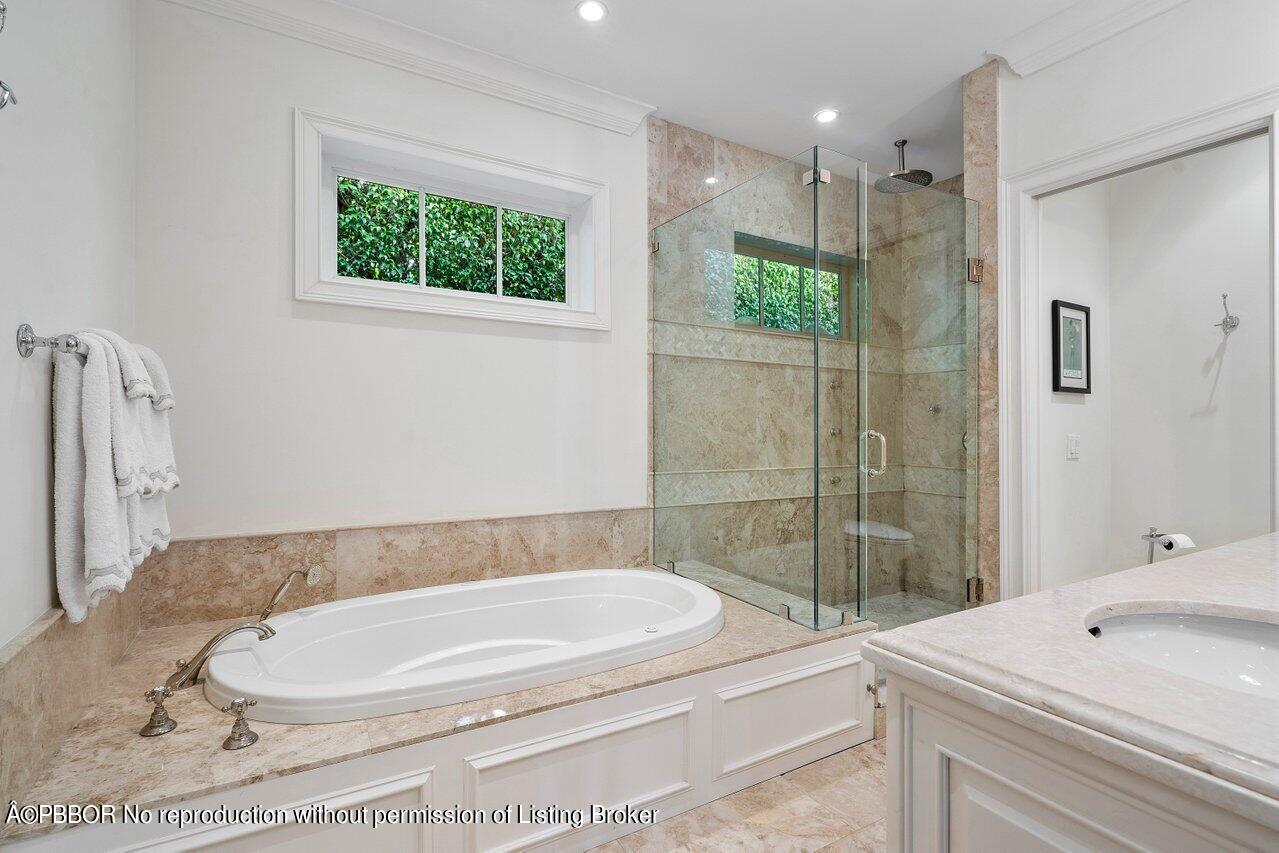 265 List Road Palm Beach, FL 33480 - Photo 19 of 39 a bathroom with a sink a toilet and shower