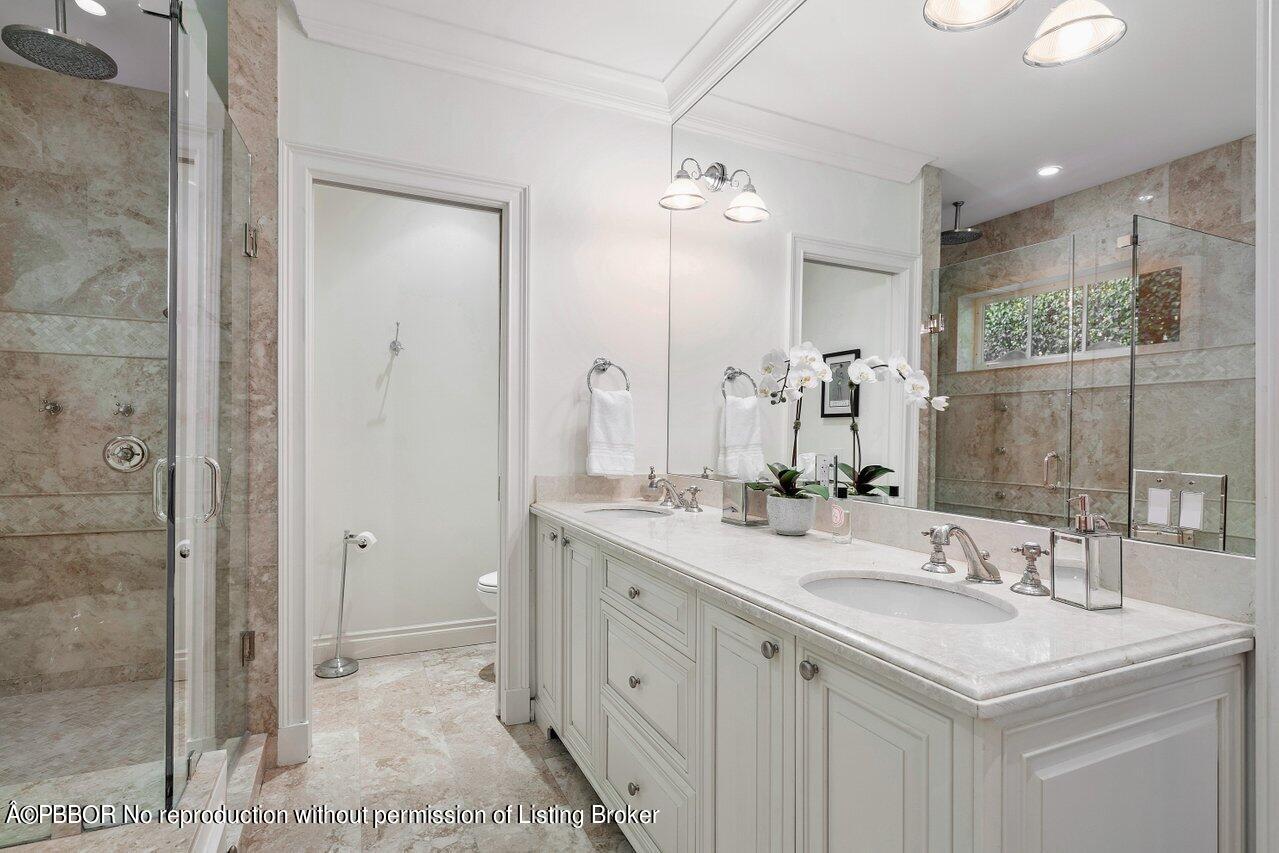 265 List Road Palm Beach, FL 33480 - Photo 20 of 39 a bathroom with a sink double vanity and a mirror