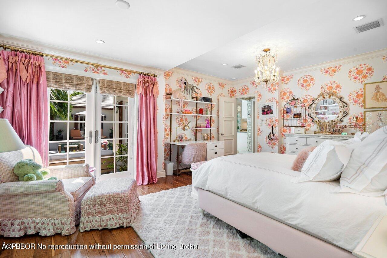 265 List Road Palm Beach, FL 33480 - Photo 22 of 39 a bedroom with a large bed and a couch