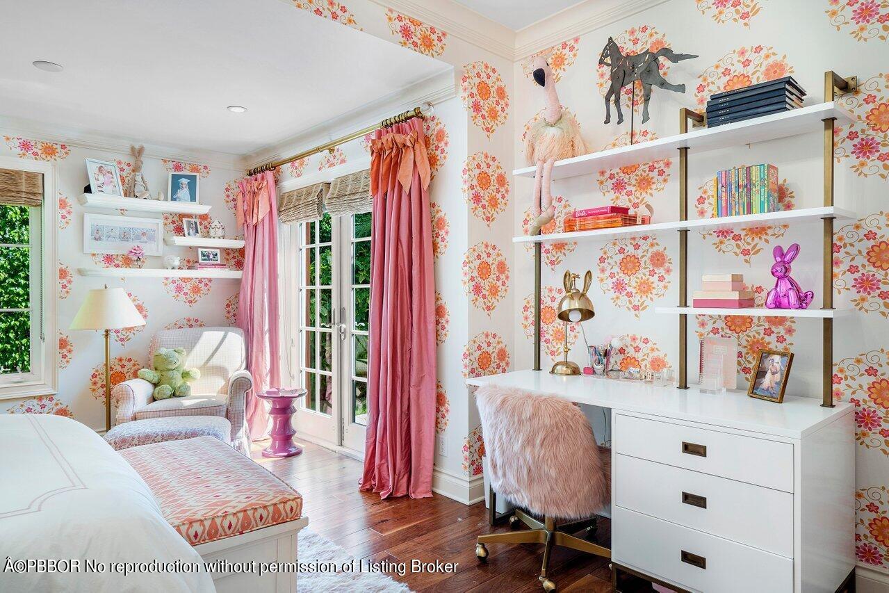 265 List Road Palm Beach, FL 33480 - Photo 23 of 39 a bed room with a bed and a book shelf