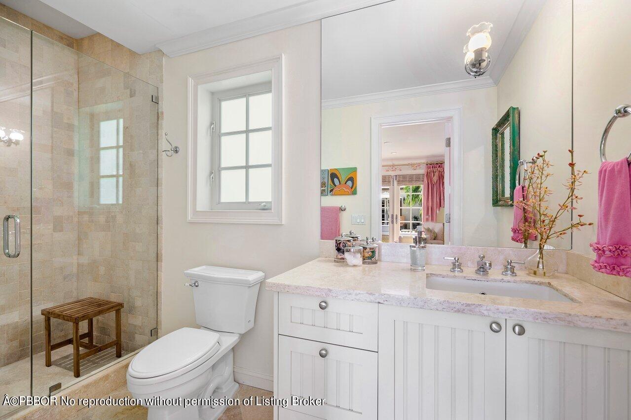 265 List Road Palm Beach, FL 33480 - Photo 24 of 39 a bathroom with a sink toilet vanity and shower