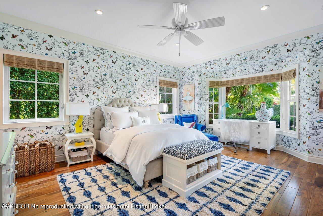 265 List Road Palm Beach, FL 33480 - Photo 25 of 39 a bedroom with a bed a couch and a window with outer view