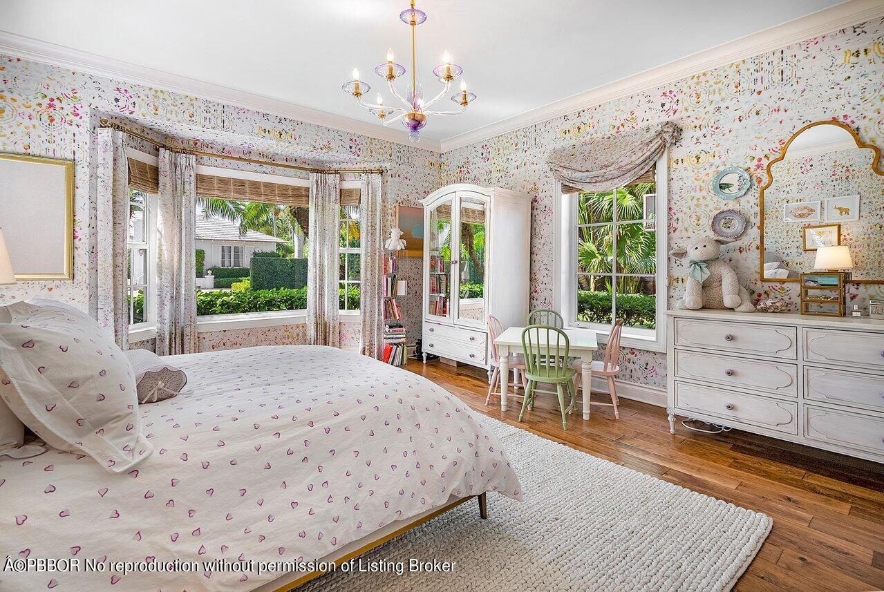 265 List Road Palm Beach, FL 33480 - Photo 28 of 39 a bedroom with a bed mirror and window