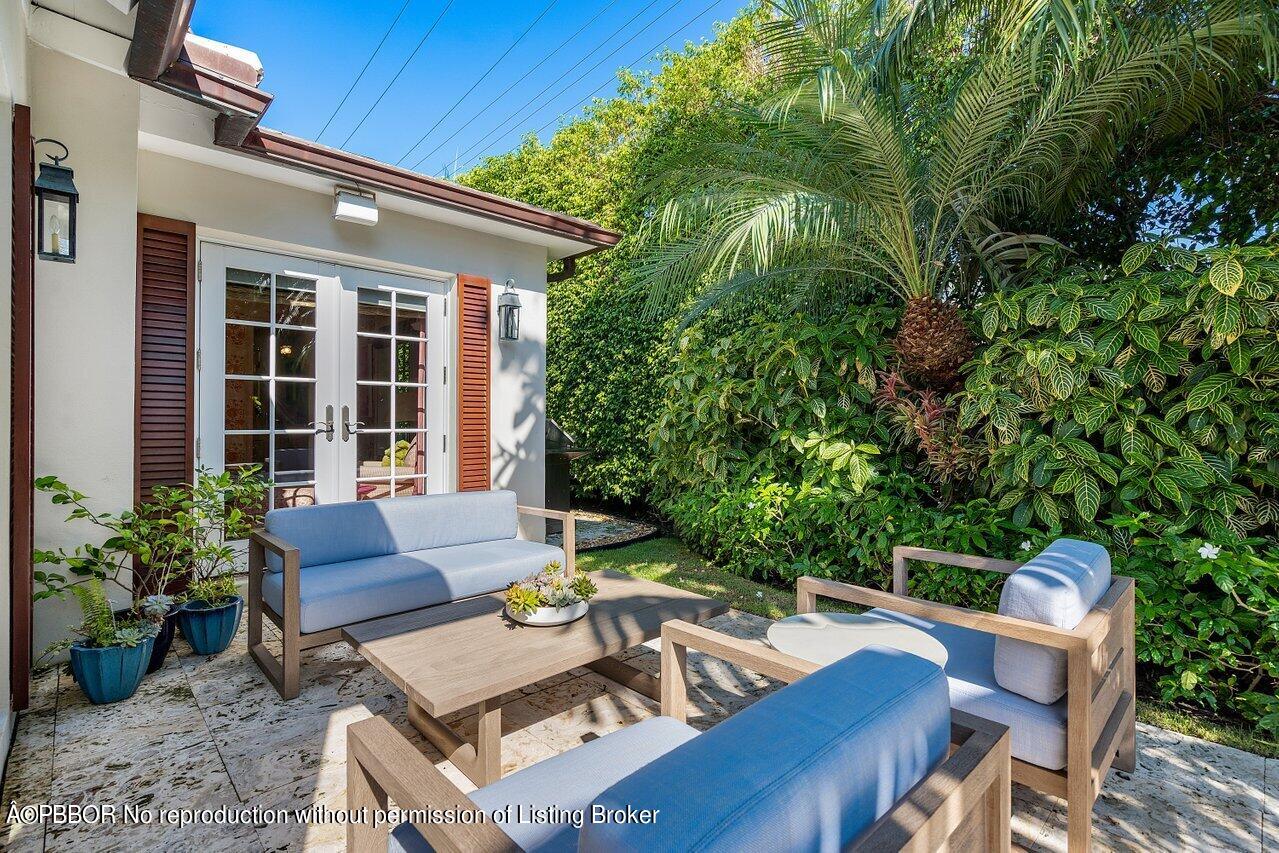 265 List Road Palm Beach, FL 33480 - Photo 30 of 39 a view of backyard with outdoor seating and plants