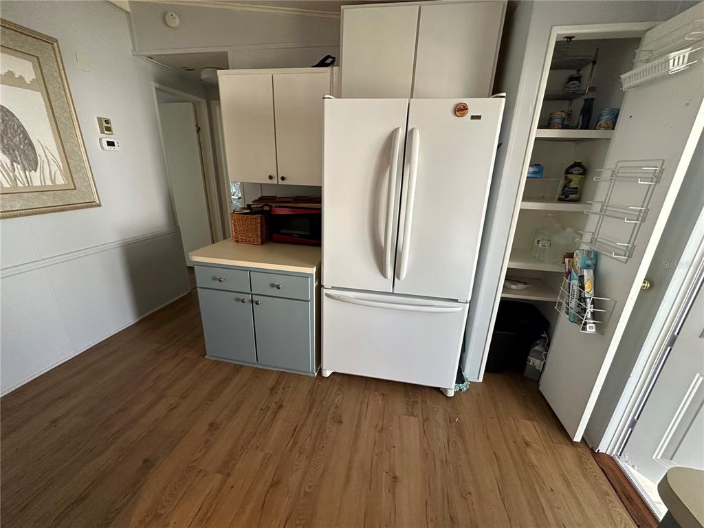 15550 Burnt Store Road, Unit 196 Punta Gorda, FL 33955 - Photo 11 of 62 a white refrigerator freezer sitting inside of a kitchen