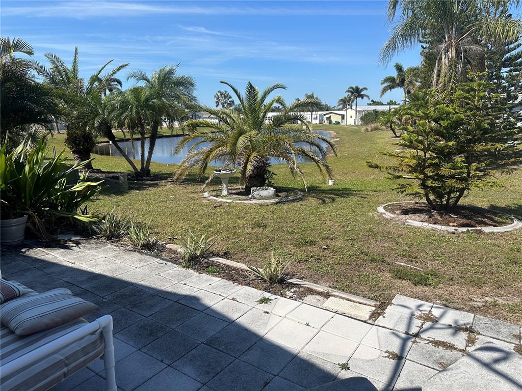 15550 Burnt Store Road, Unit 196 Punta Gorda, FL 33955 - Photo 34 of 62 a view of a yard with palm tree