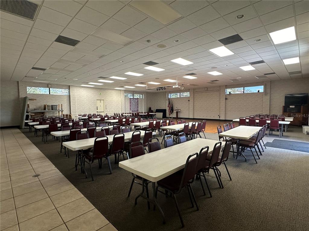 15550 Burnt Store Road, Unit 196 Punta Gorda, FL 33955 - Photo 51 of 62 a group of people sitting at tables in a room