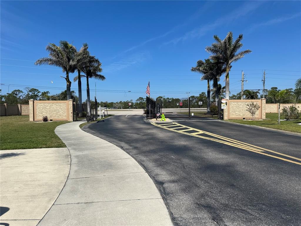 15550 Burnt Store Road, Unit 196 Punta Gorda, FL 33955 - Photo 53 of 62 a view of a house with palm trees