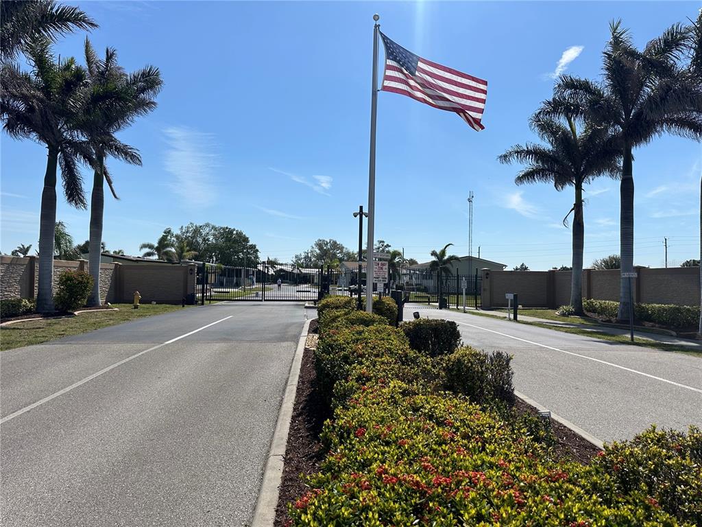 15550 Burnt Store Road, Unit 196 Punta Gorda, FL 33955 - Photo 54 of 62 a view of a street with a cars parked on the road