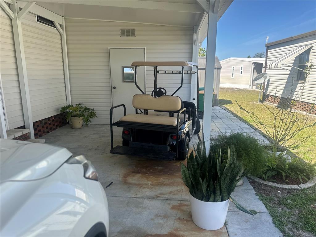 15550 Burnt Store Road, Unit 196 Punta Gorda, FL 33955 - Photo 56 of 62 a living room with furniture and a potted plant