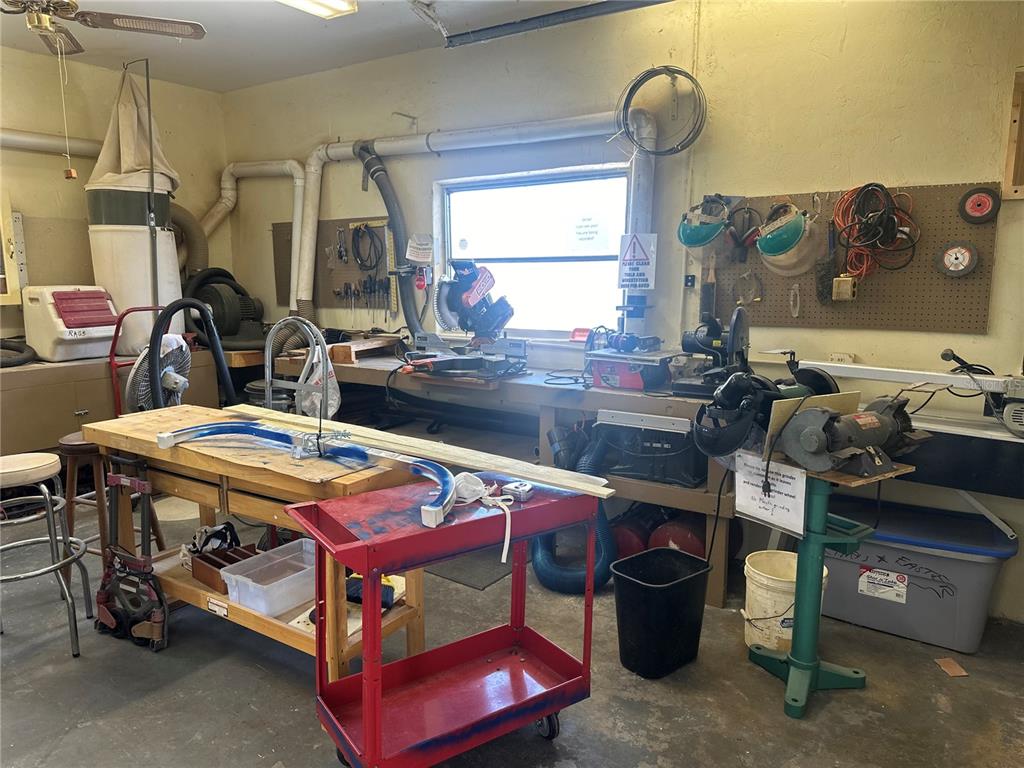 15550 Burnt Store Road, Unit 196 Punta Gorda, FL 33955 - Photo 60 of 62 a view of a room that has a bed table and chairs