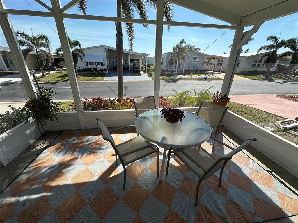 15550 Burnt Store Road, Unit 196 Punta Gorda, FL 33955 - Photo 7 of 62 a view of a dining room with furniture and a window