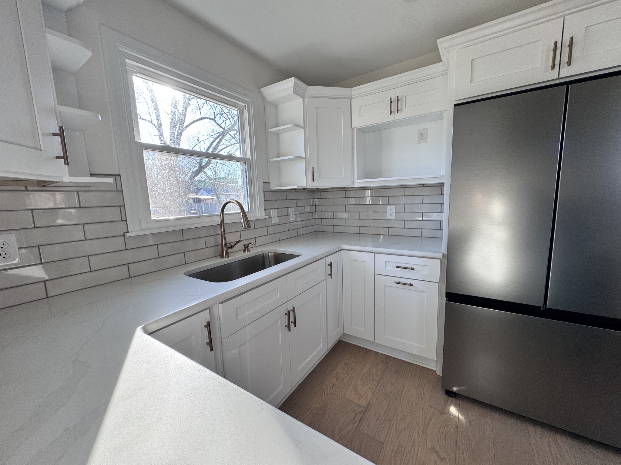 331 Oriel Avenue Nashville, TN 37210 - Photo 13 of 49 a kitchen with white cabinets and a refrigerator