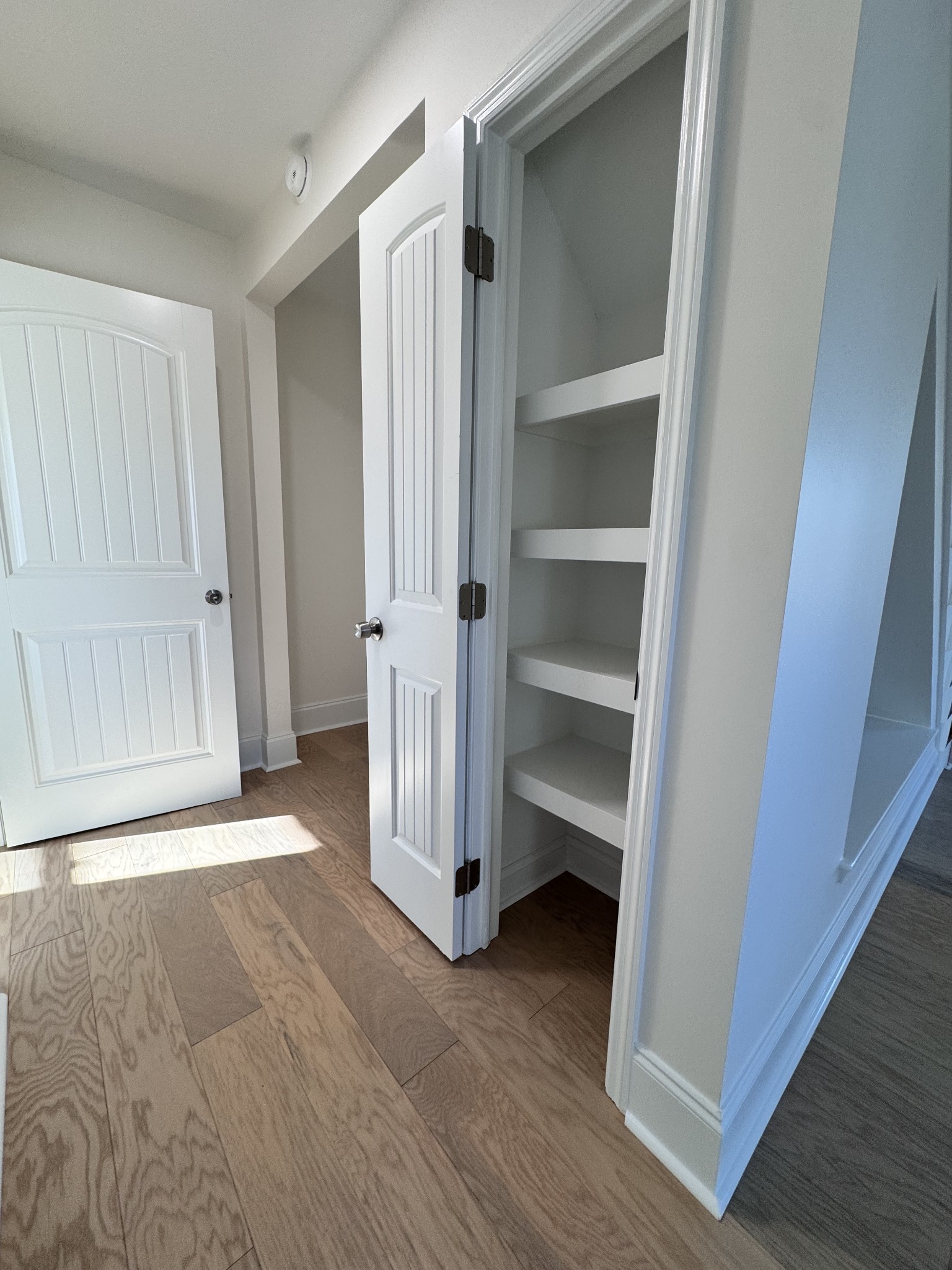 331 Oriel Avenue Nashville, TN 37210 - Photo 14 of 49 a view of an empty room with wooden floor and closet area