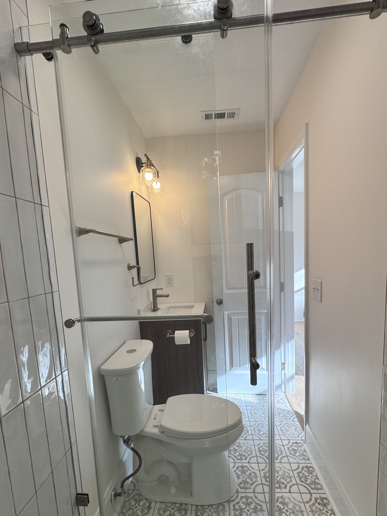 331 Oriel Avenue Nashville, TN 37210 - Photo 19 of 49 a bathroom with a sink toilet a mirror and shower