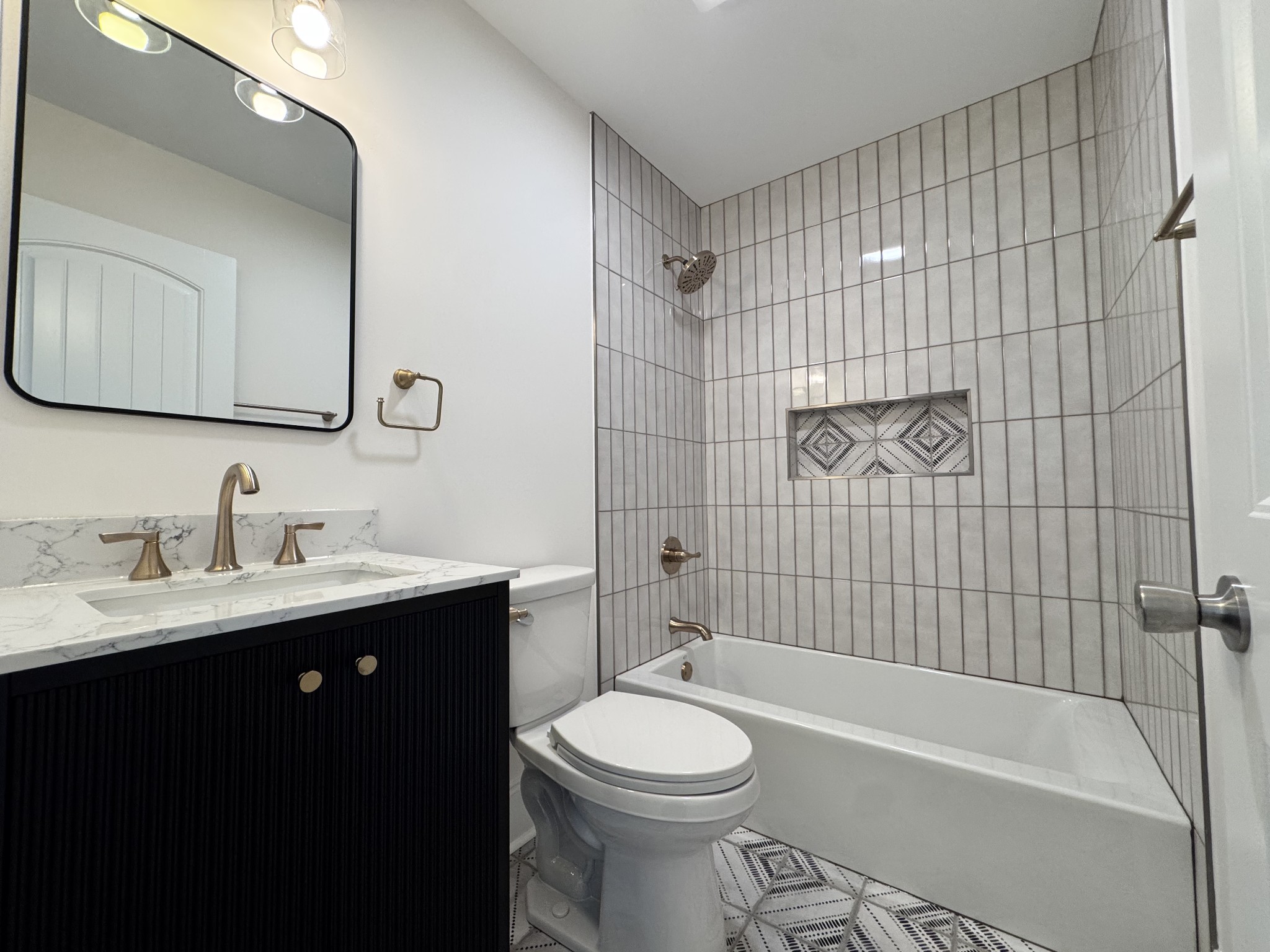 331 Oriel Avenue Nashville, TN 37210 - Photo 22 of 49 a bathroom with a toilet a sink a mirror and bathtub