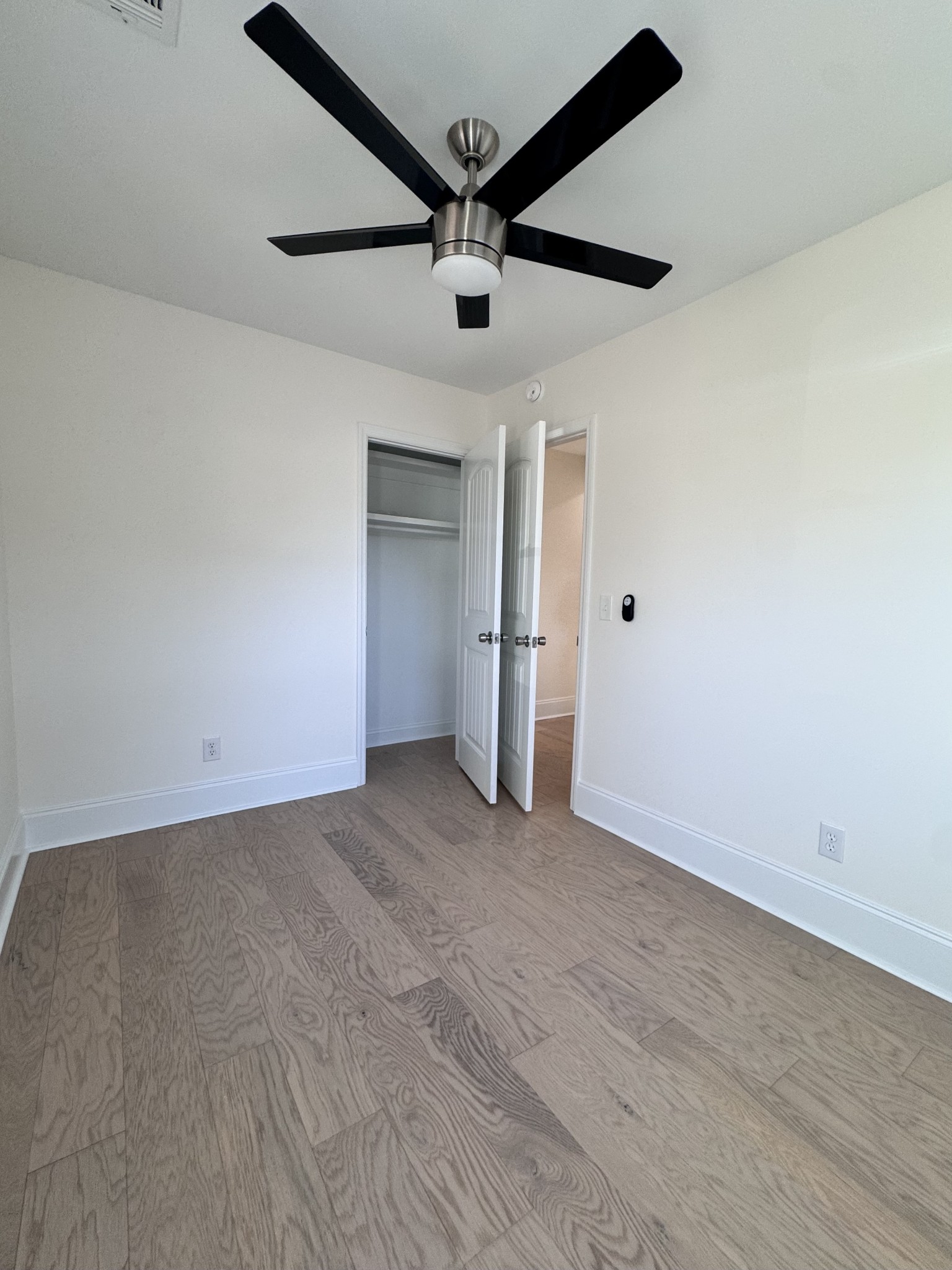 331 Oriel Avenue Nashville, TN 37210 - Photo 27 of 49 an empty room with closet and a ceiling fan