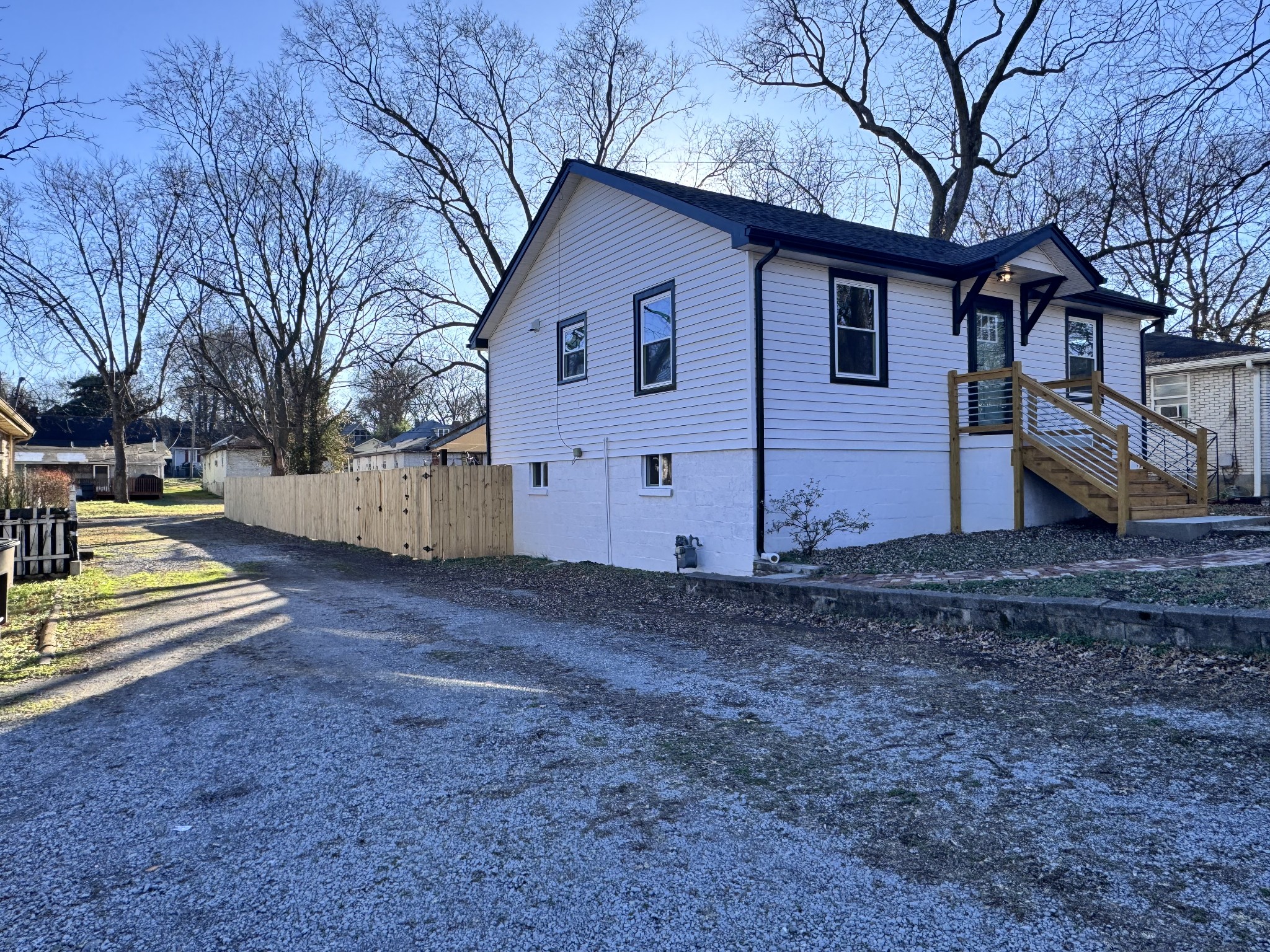 331 Oriel Avenue Nashville, TN 37210 - Photo 3 of 49 a view of a house with a yard covered in snow