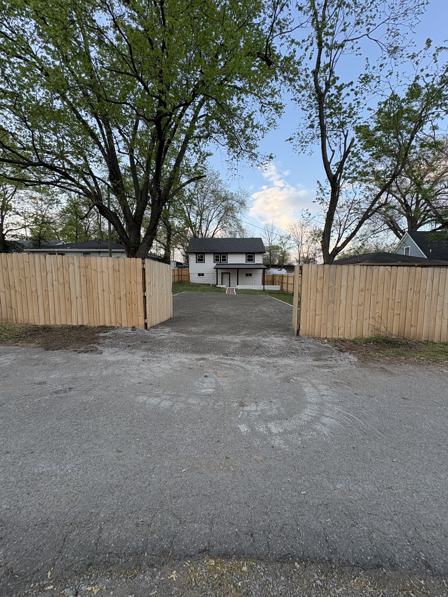 331 Oriel Avenue Nashville, TN 37210 - Photo 49 of 49 a view of a backyard with large trees and wooden fence