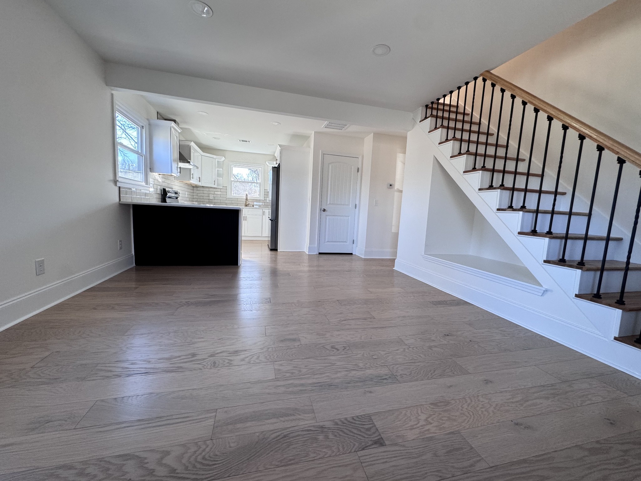 331 Oriel Avenue Nashville, TN 37210 - Photo 9 of 49 a view of a hallway with wooden floor and staircase
