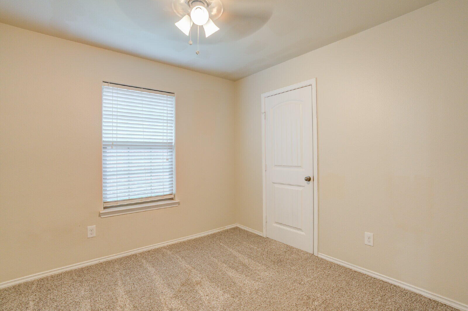 6921 95th Street Lubbock, TX 79424 - Photo 17 of 32 a view of an empty room with a window