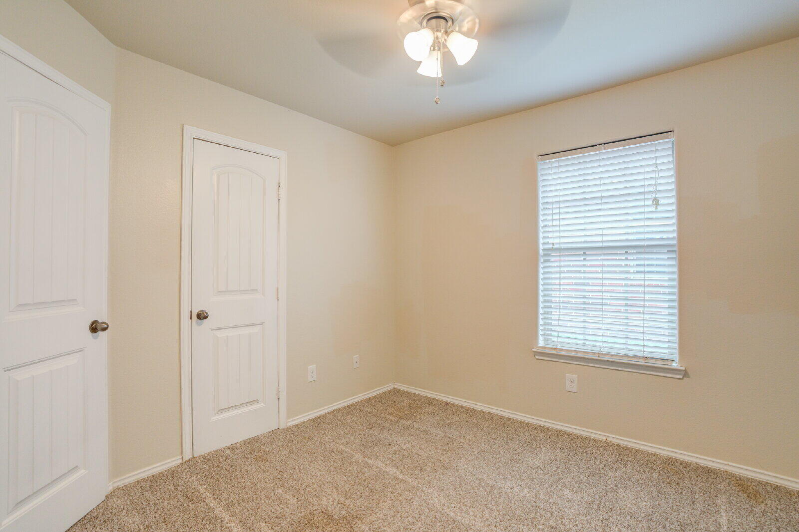 6921 95th Street Lubbock, TX 79424 - Photo 19 of 32 a view of an empty room with a window