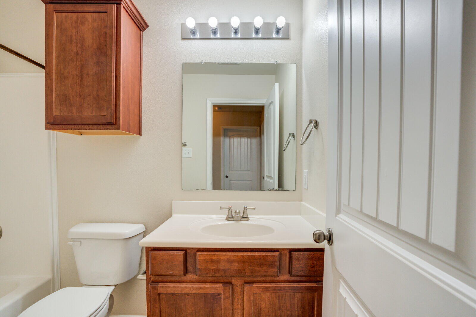 6921 95th Street Lubbock, TX 79424 - Photo 22 of 32 a bathroom with a sink and a toilet