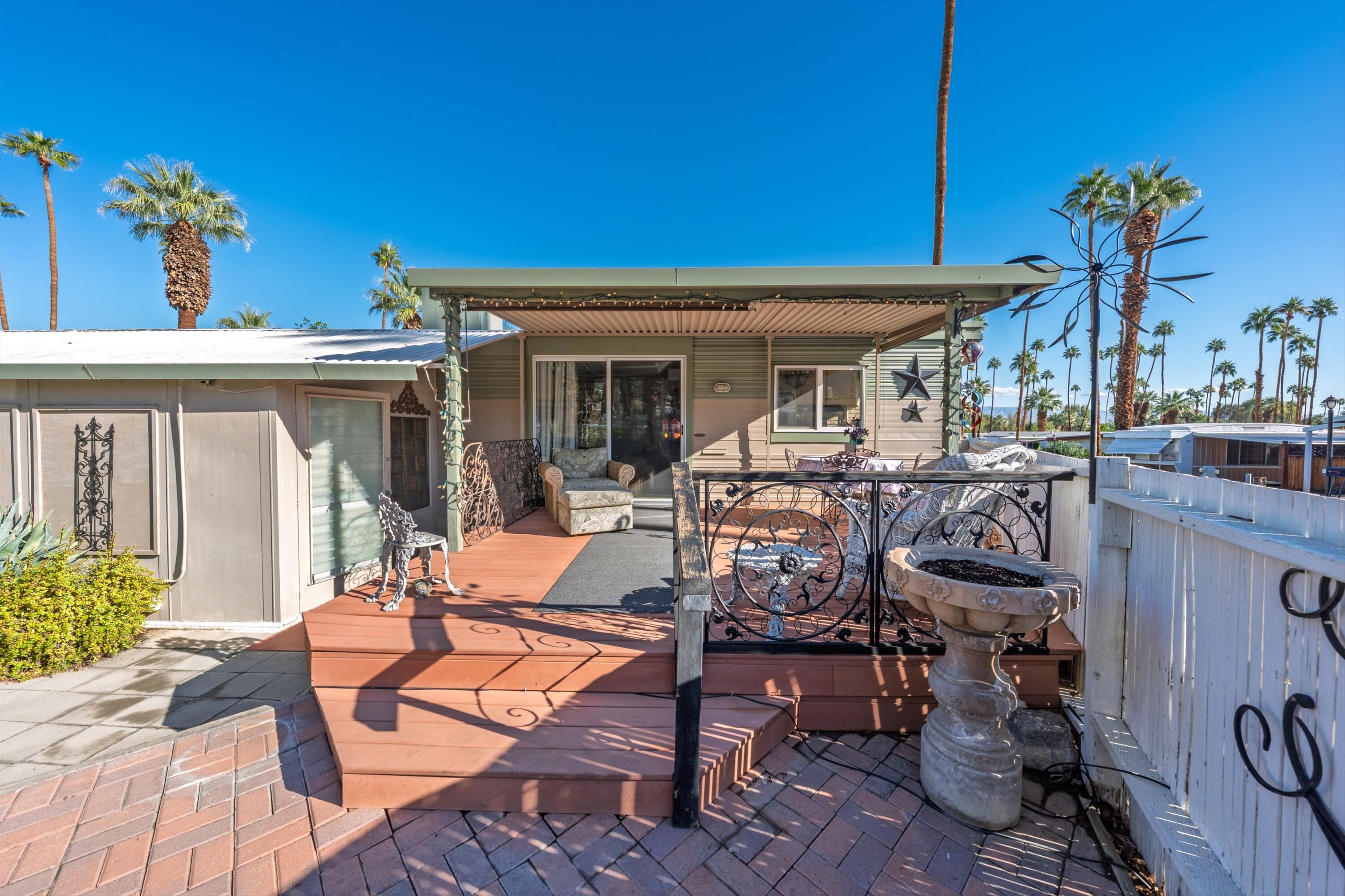 70260 Highway 111, Unit 42 Rancho Mirage, CA 92270 - Photo 15 of 35 a view of a house with patio