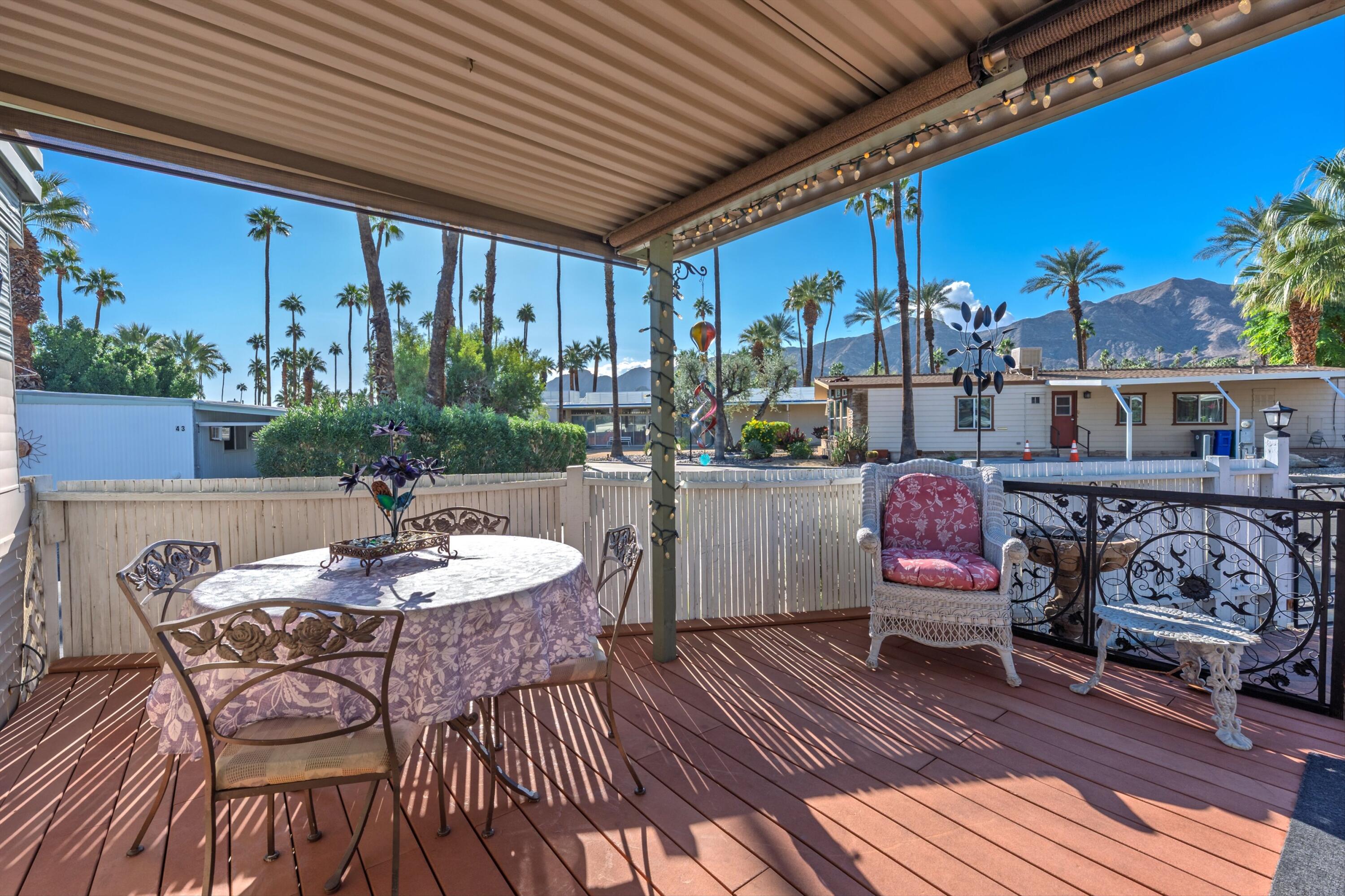 70260 Highway 111, Unit 42 Rancho Mirage, CA 92270 - Photo 2 of 35 a view of a dining tables and chairs in the patio