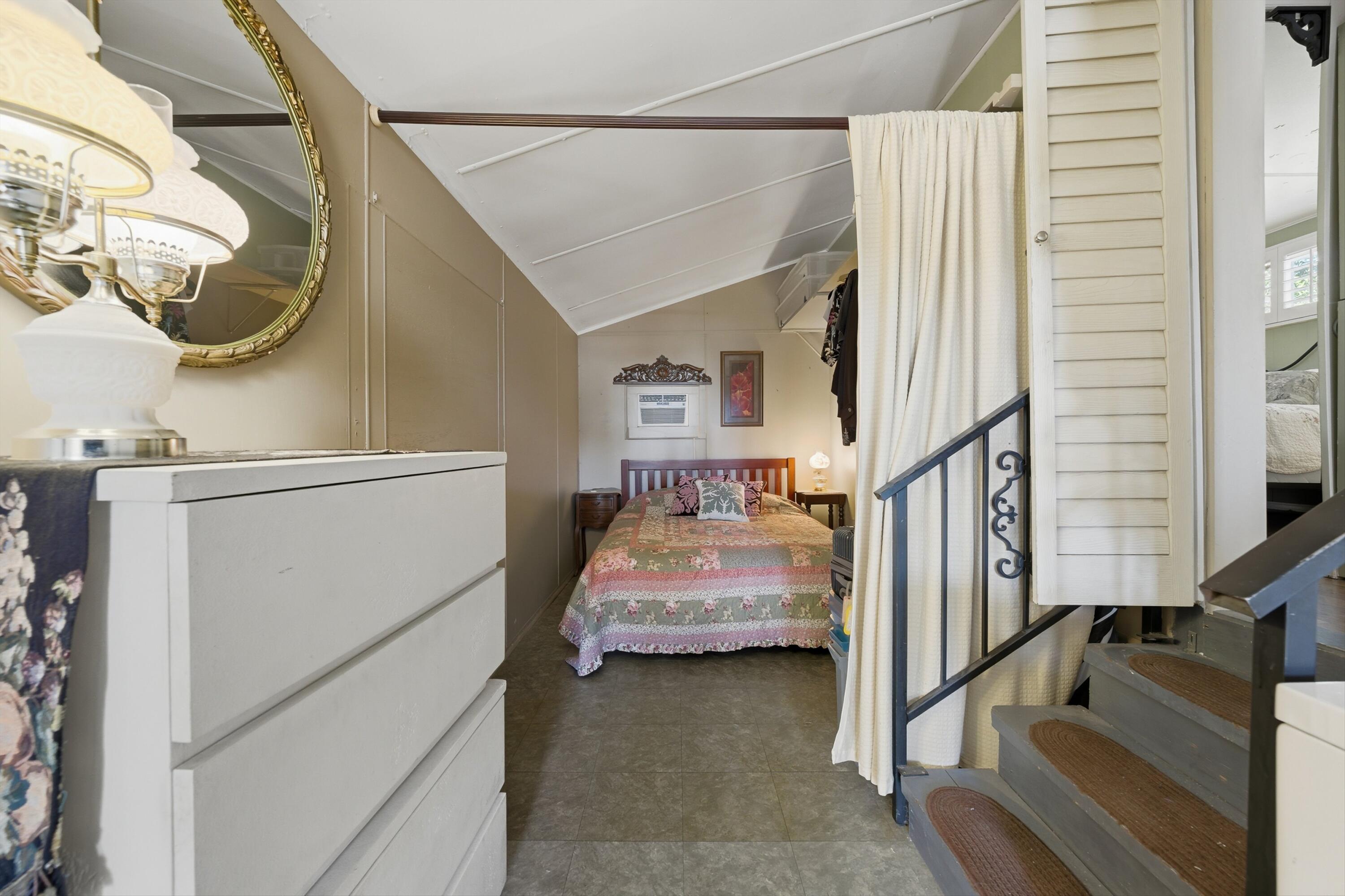 70260 Highway 111, Unit 42 Rancho Mirage, CA 92270 - Photo 25 of 35 a bedroom with a bed and a large window