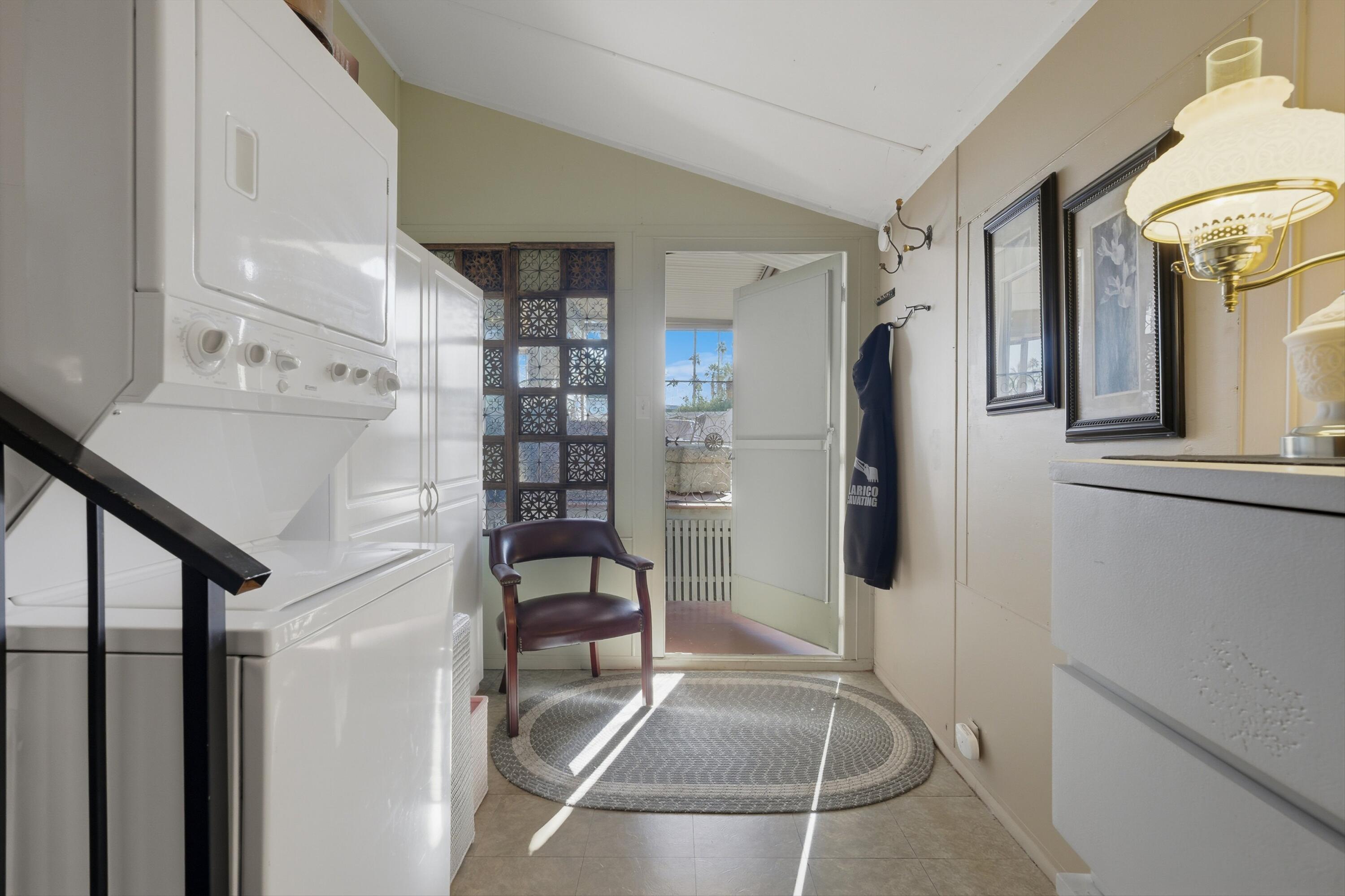 70260 Highway 111, Unit 42 Rancho Mirage, CA 92270 - Photo 26 of 35 a view of entryway and hall with wooden floor
