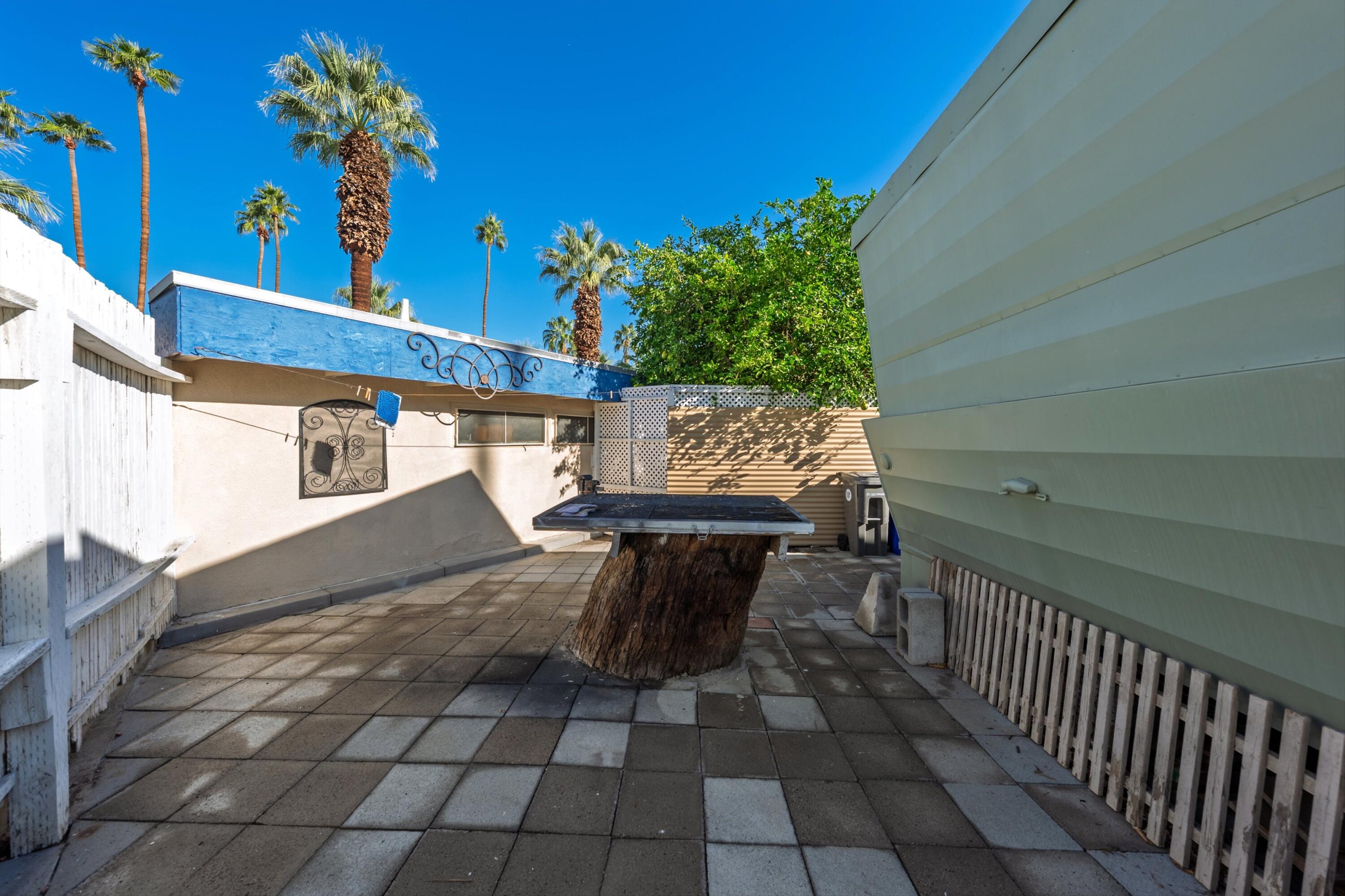 70260 Highway 111, Unit 42 Rancho Mirage, CA 92270 - Photo 28 of 35 a view of entryway with flower pots