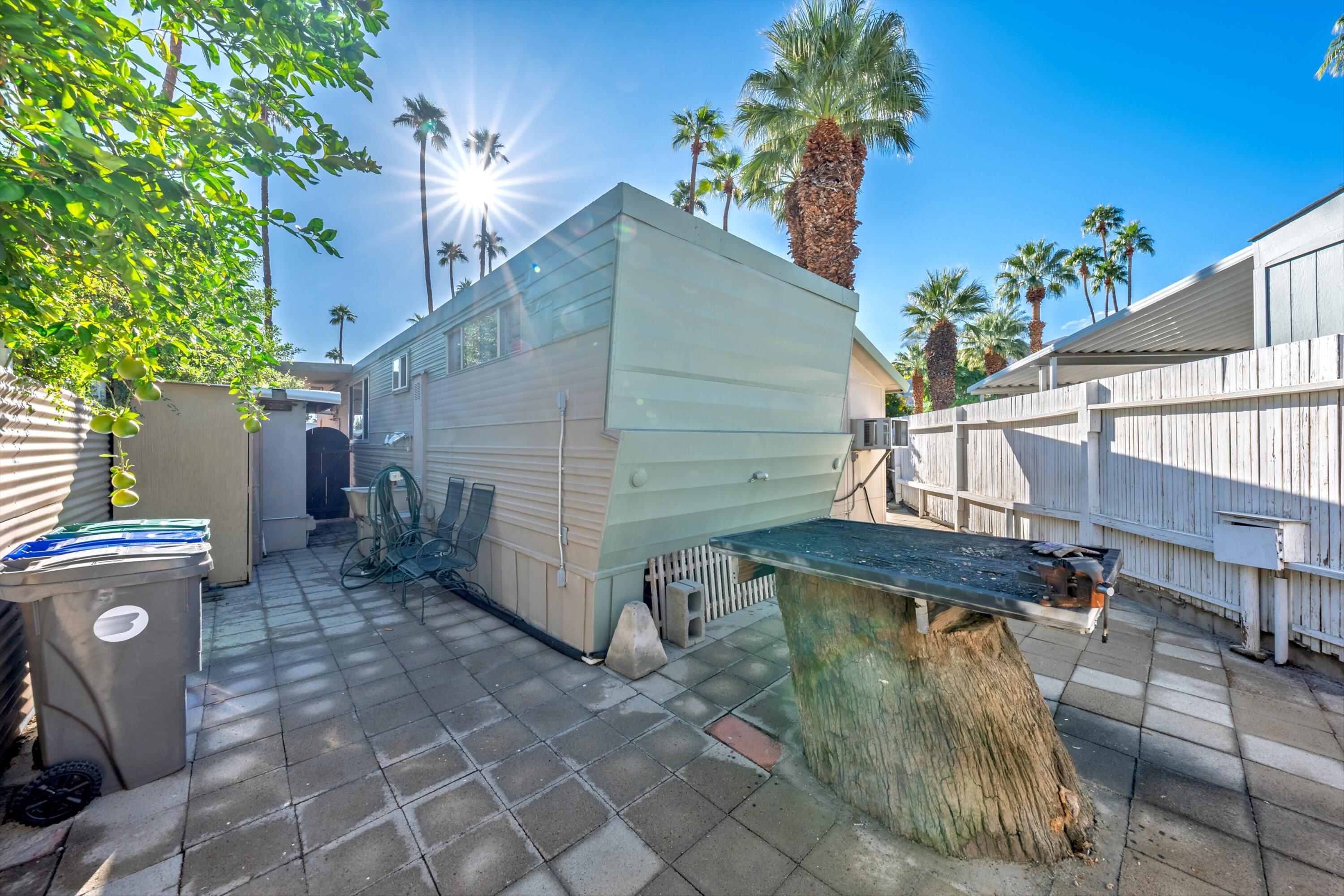 70260 Highway 111, Unit 42 Rancho Mirage, CA 92270 - Photo 29 of 35 a view of a house with a yard