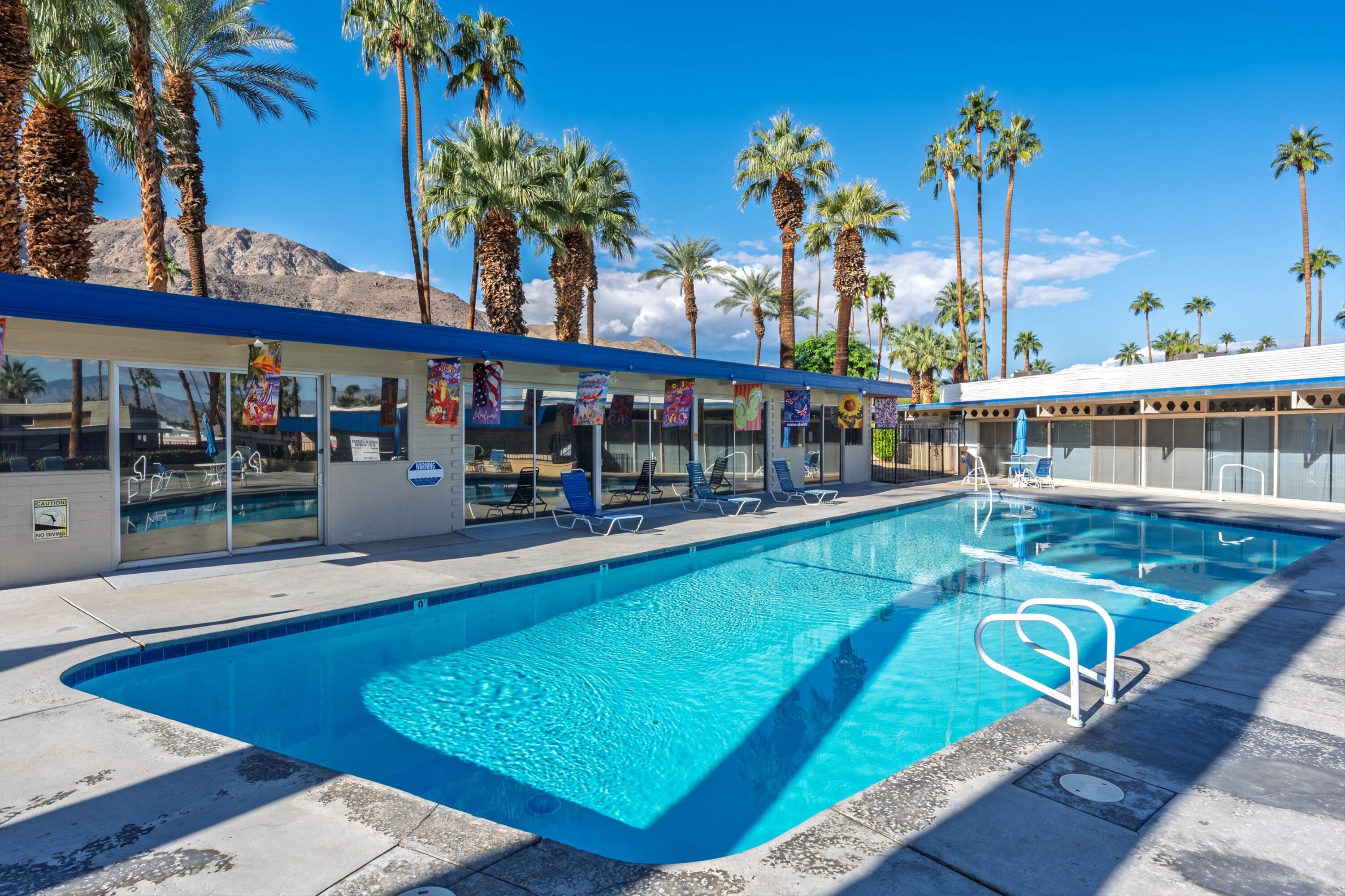70260 Highway 111, Unit 42 Rancho Mirage, CA 92270 - Photo 31 of 35 a view of a swimming pool with a patio