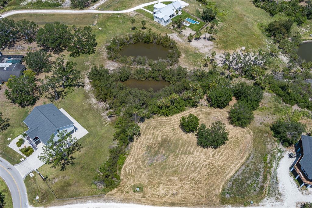 818 Bayou Point Terra Ceia, FL 34250 - Photo 13 of 17 an aerial view of a house with a yard
