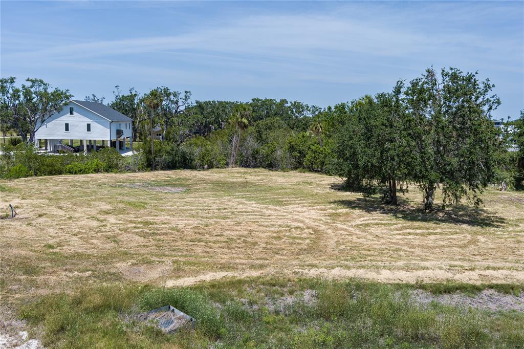818 Bayou Point Terra Ceia, FL 34250 - Photo 4 of 17 a view of a field with a house in the background