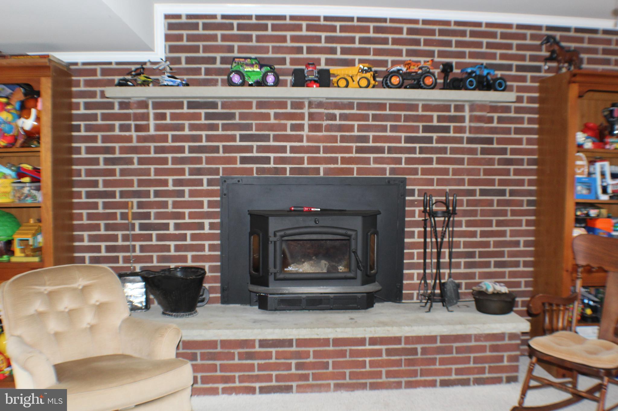 4249 Razor Hill Road Bealeton, VA 22712 - Photo 31 of 61 Brick fireplace with woodstove insert