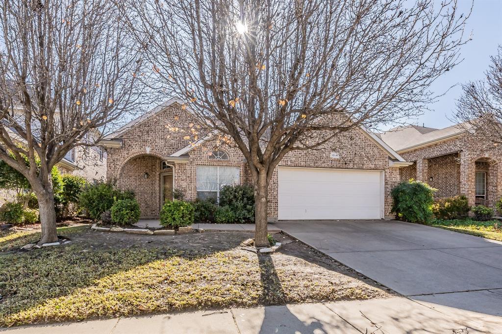 1014 Shortleaf Pine Drive Arlington, TX 76012 - Photo 1 of 1 a front view of a house with a yard and garage