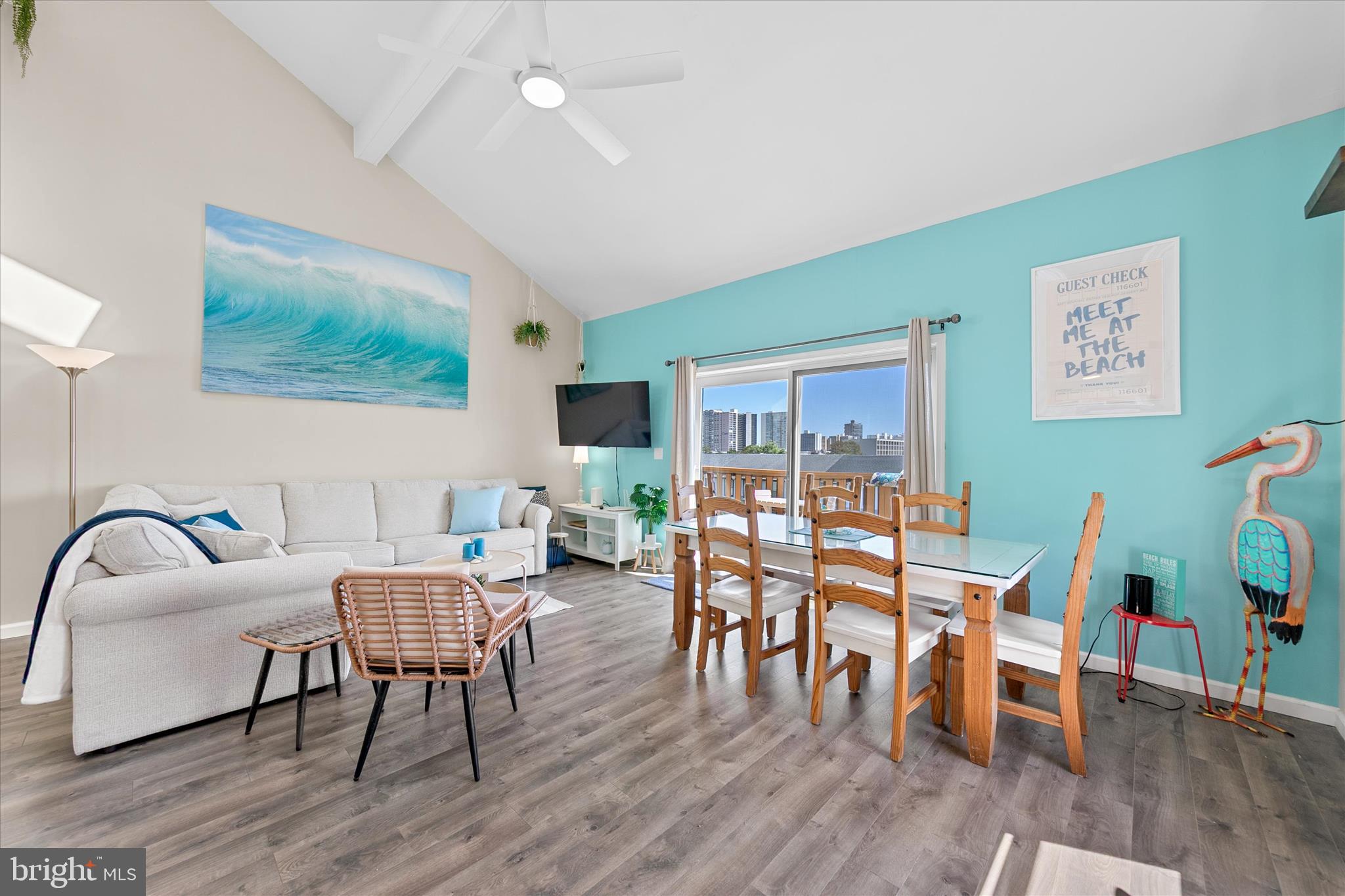 132 Jamestown Road, Unit 601 Ocean City, MD 21842 - Photo 5 of 37 a dining room with furniture window and wooden floor