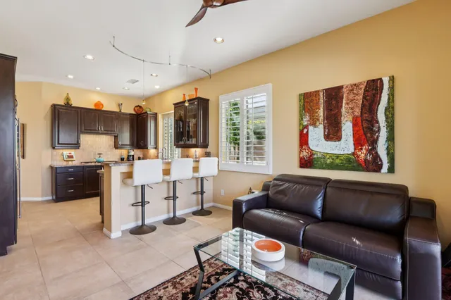 a kitchen with a sink a stove and wooden cabinets