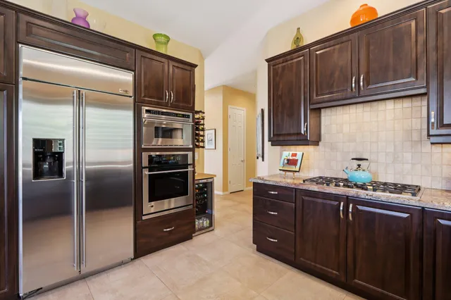 a large room with a bed and window