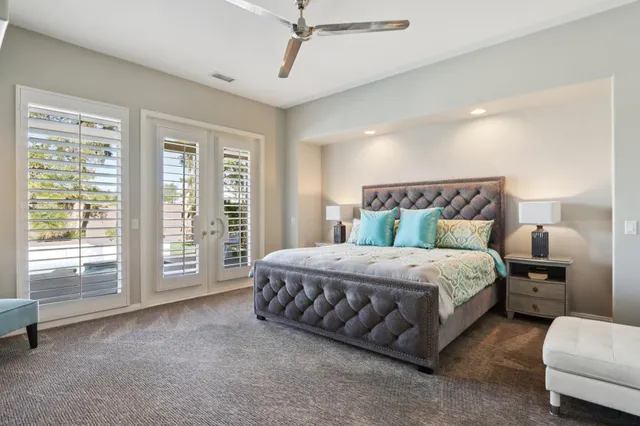 a bathroom with a bathtub a shower and a window