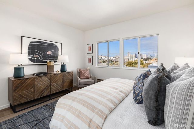 a front view of a house with trees