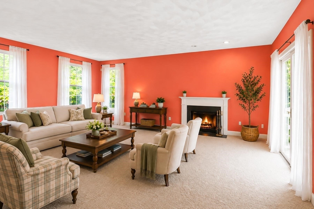 4 Forest Street Georgetown, MA 01833 - Photo 7 of 37 a living room with furniture a fireplace and a large window
