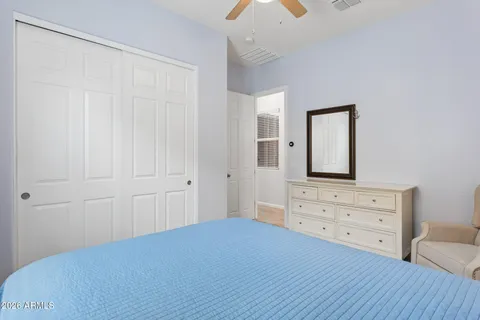 a bedroom with a bed and chair