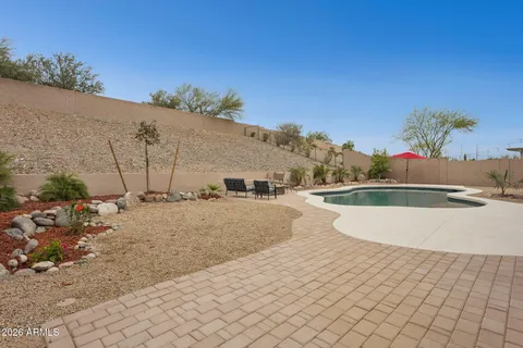 a view of a swimming pool with lounge chair