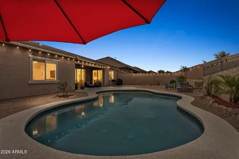 a view of a swimming pool with a lounge chairs