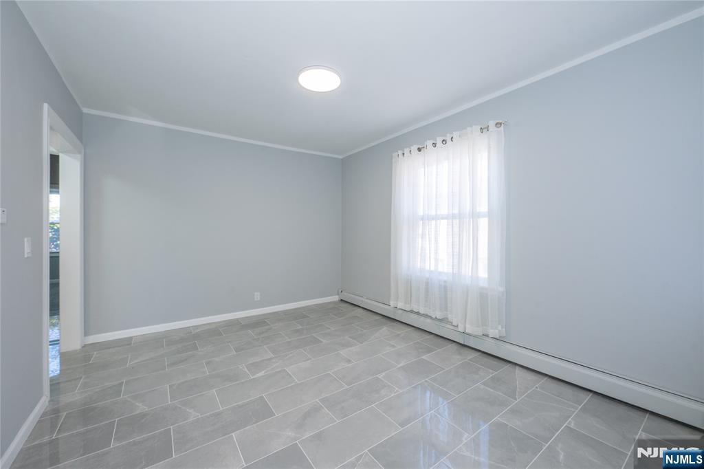 723 East 26th Street Paterson, NJ 07504 - Photo 29 of 41 an empty room with windows