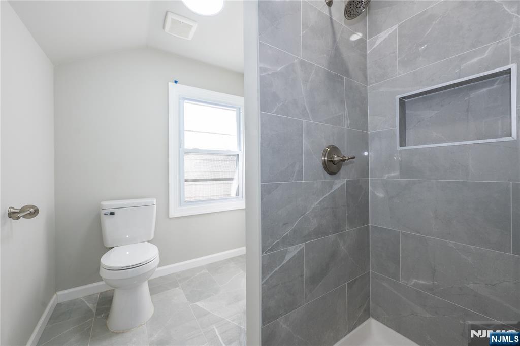 723 East 26th Street Paterson, NJ 07504 - Photo 36 of 41 a bathroom with a toilet and a shower